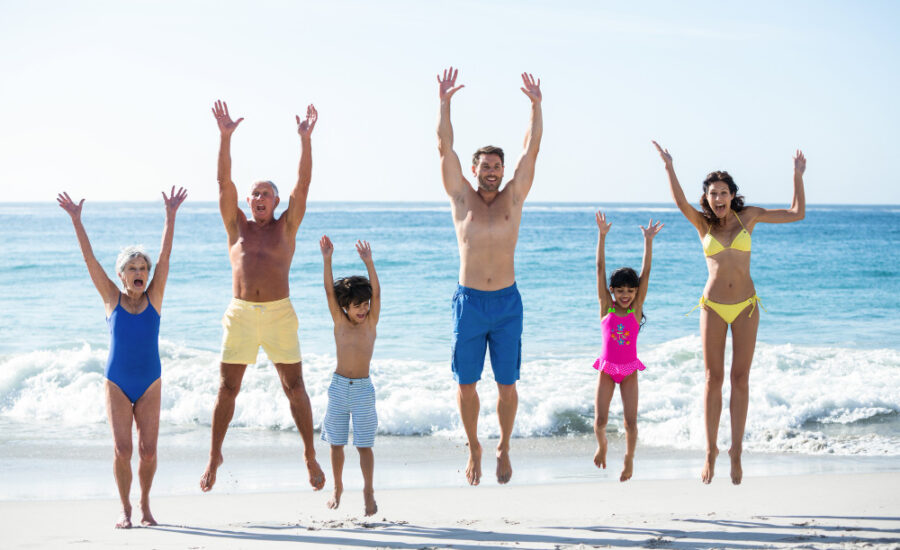 happy-family-jumping-beach